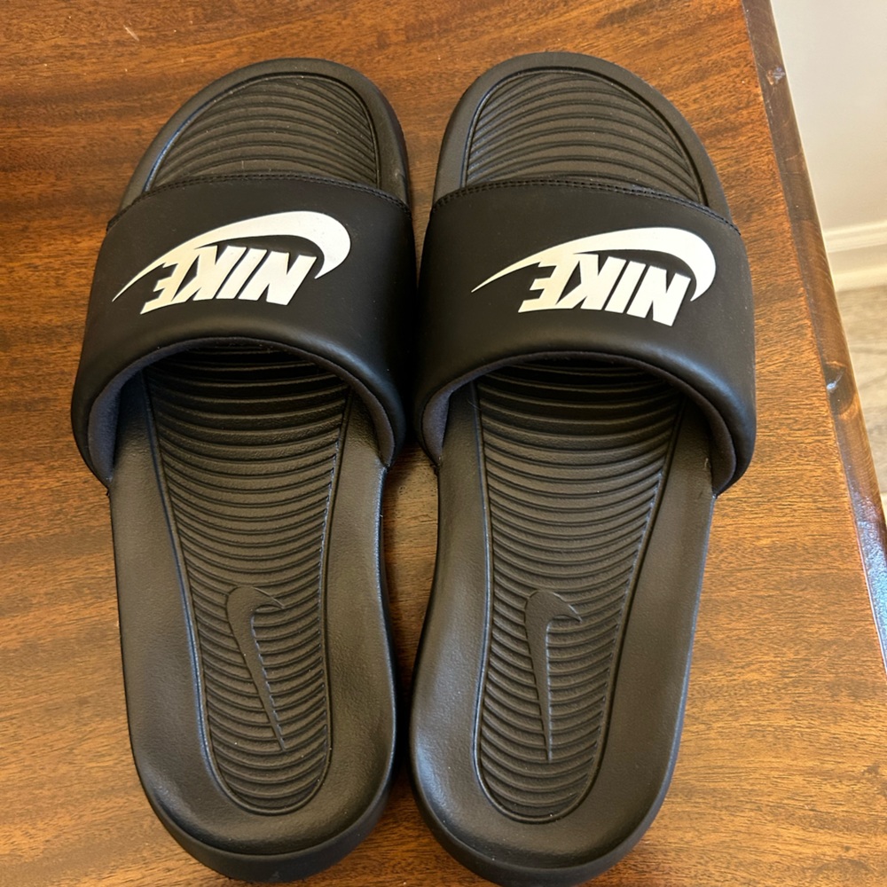 Nike men’s black slides. Size 10